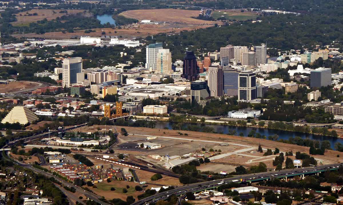 Aerial view of downtown Sacramento with the river and Tower Bridge on the left